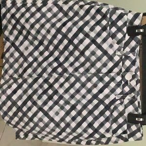 Women’s skorts, NWOT. Black and white, has front zipper and button.